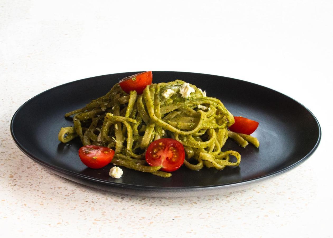 Neano Escape Hotel Manggis  Exterior photo A plate of pasta with pesto