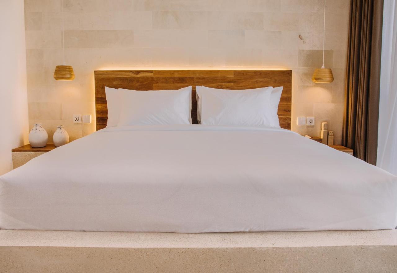 Neano Escape Hotel Manggis  Exterior photo A bed with a mattress and a bed frame