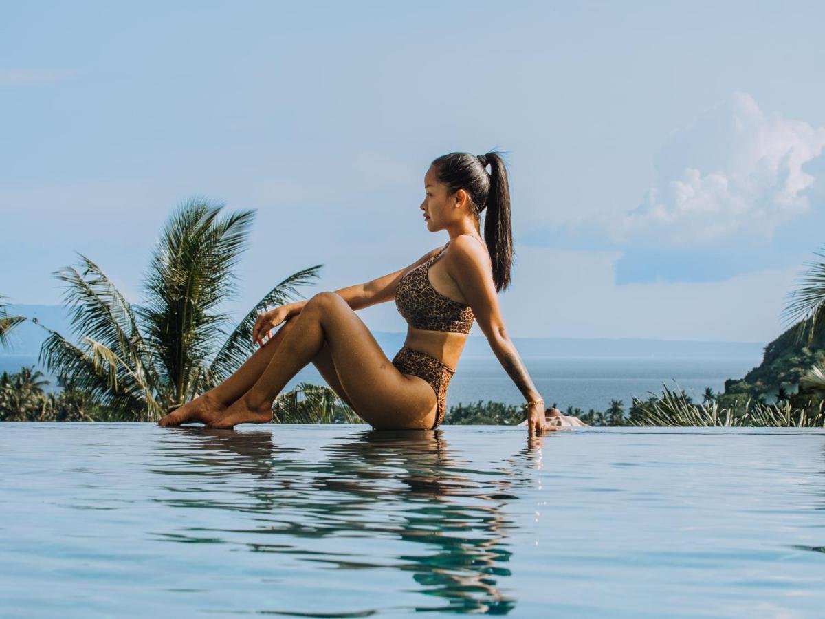 Neano Escape Hotel Manggis  Exterior photo A woman wearing a bikini