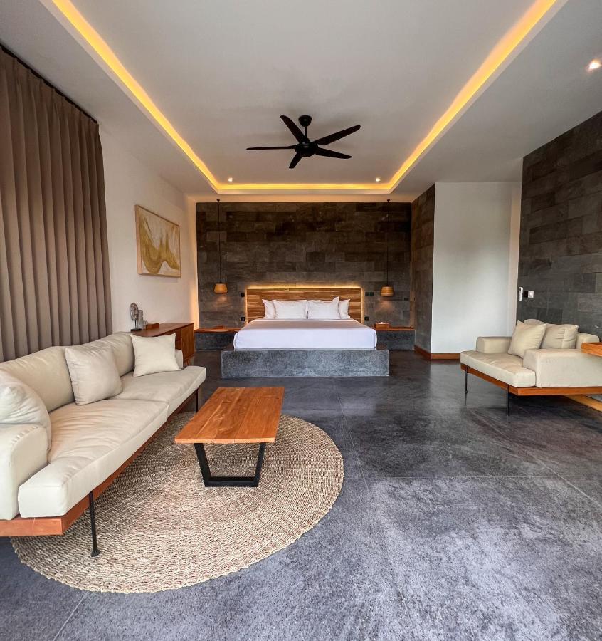 Neano Escape Hotel Manggis  Exterior photo A bedroom at the resort