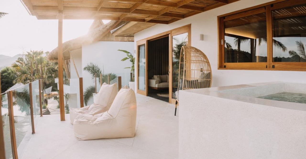 Neano Escape Hotel Manggis  Exterior photo The interior of a villa at the resort
